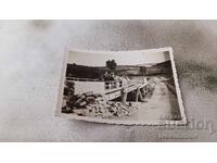 Photo Officer and men on a bridge over the Jebel River 1939