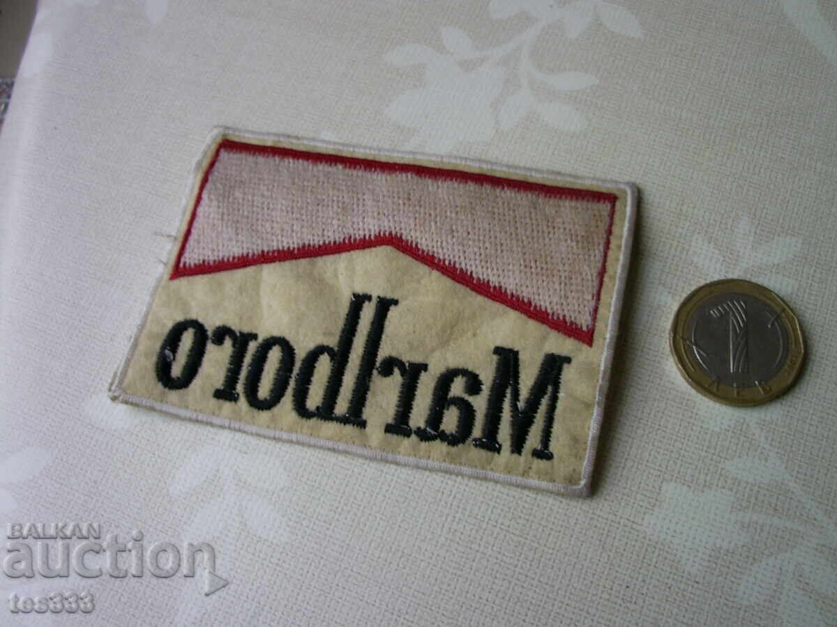 Delivery of woven Marlboro emblem Delivery of woven Marlboro emblem