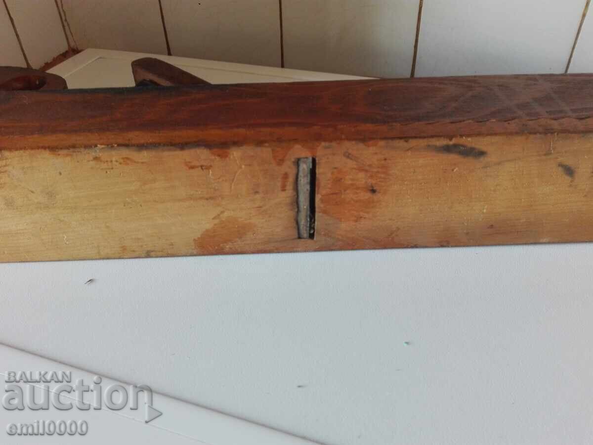 A large, old carpenter's planer. - 5 A large, old carpenter's planer. - 5