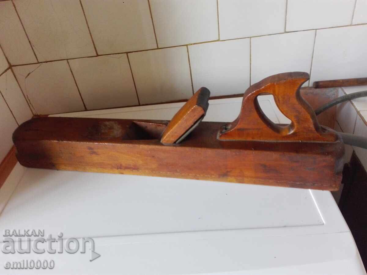 A large, old carpenter's planer. A large, old carpenter's planer.