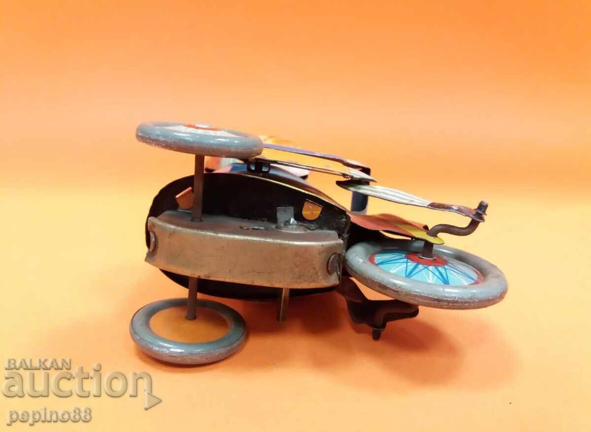 Delivery of Old metal toy with a winding mechanism Delivery of Old metal toy with a winding mechanism