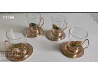 4 pcs of glass tea cups with coasters.