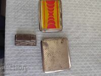 An old lighter and snuffboxes