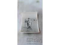 Photo Kiten Man in a swimsuit in the sea 1963