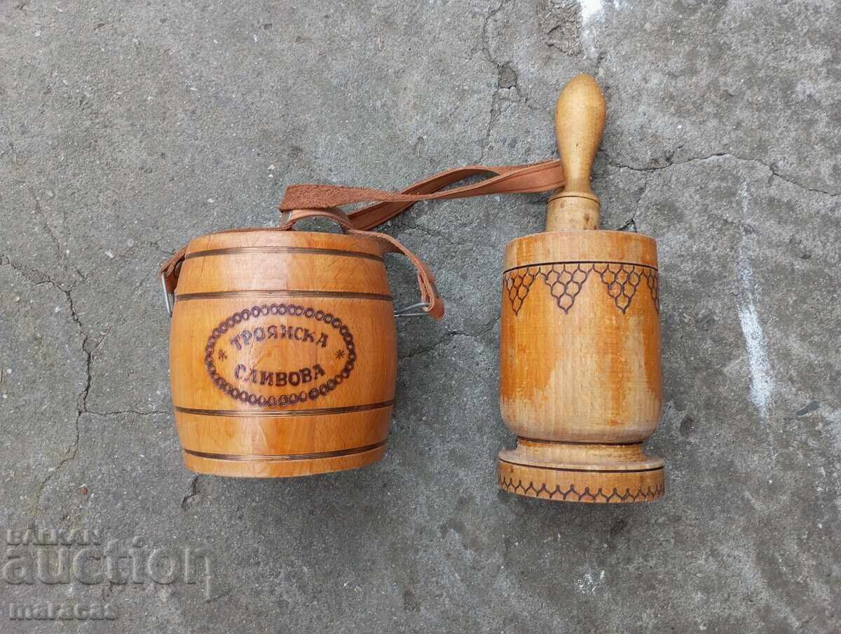 Old wooden mortar and pestle and souvenir barrel Old wooden mortar and pestle and souvenir barrel