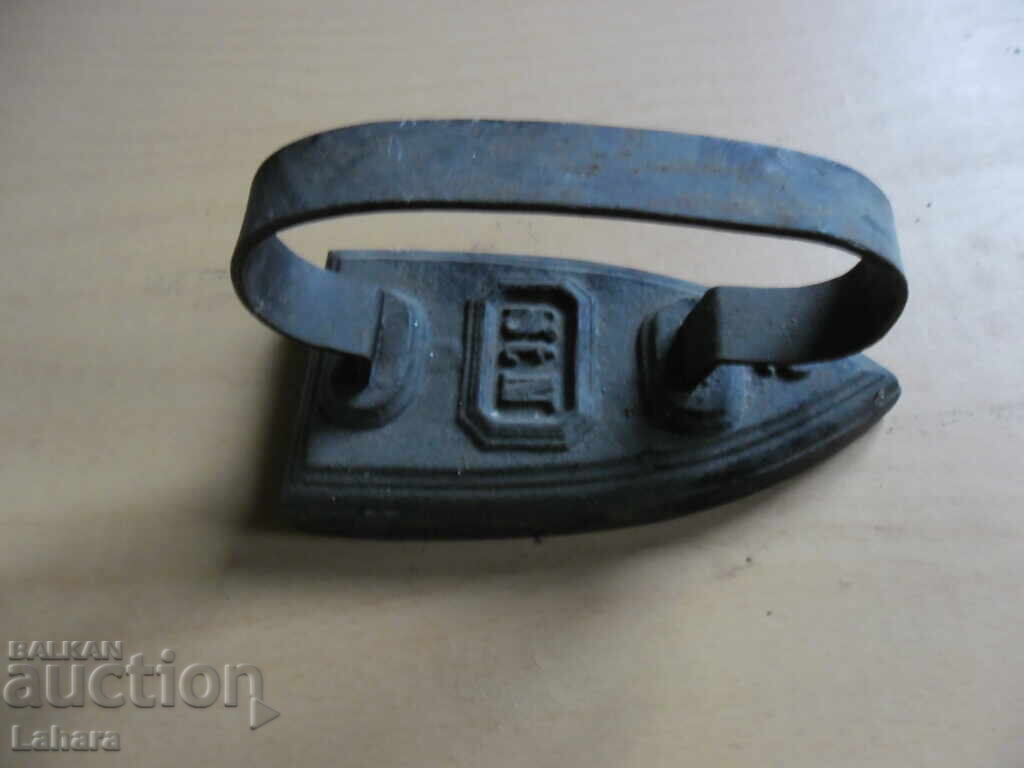 Auction  Antique metal iron