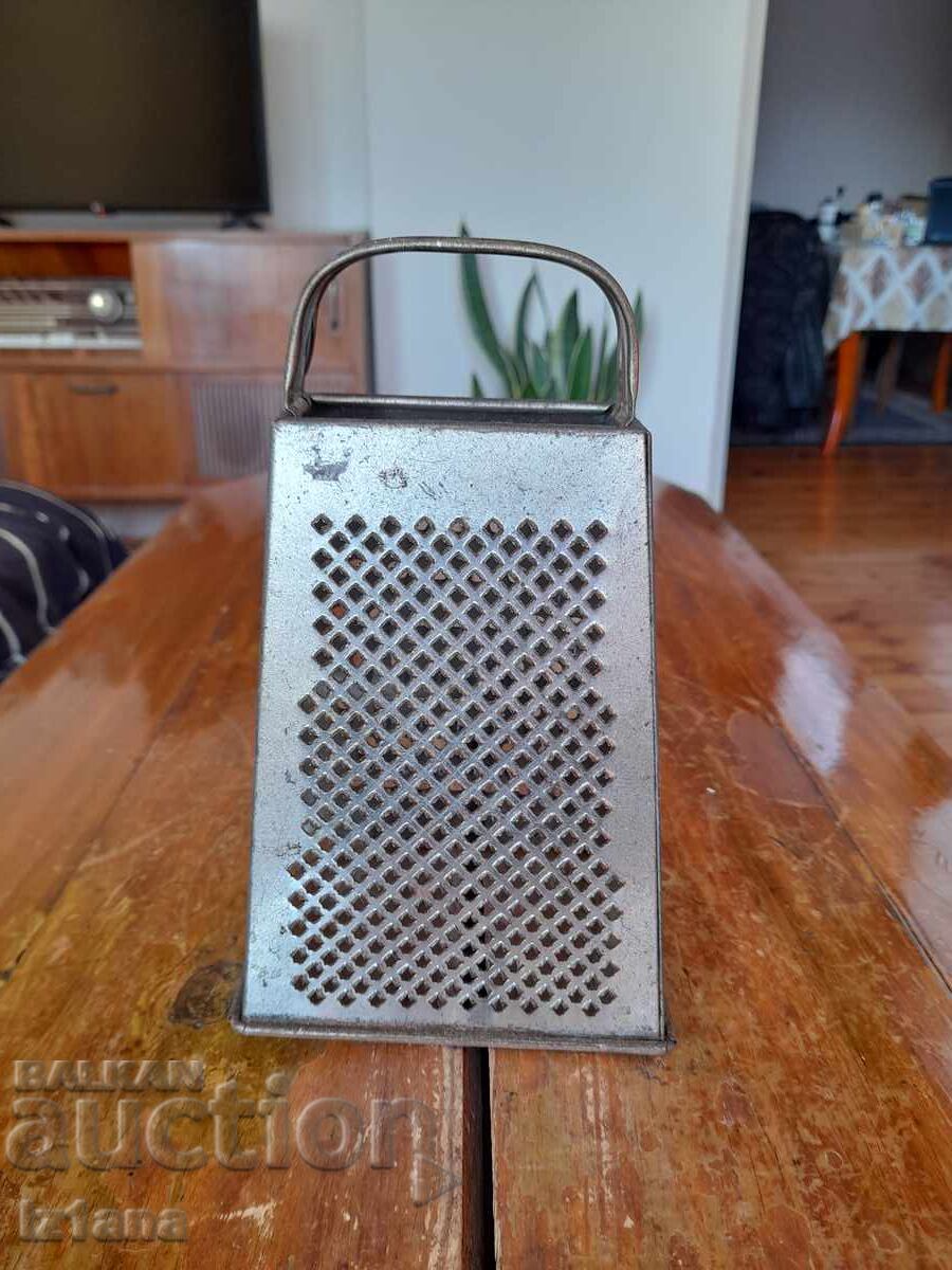 Auction An old kitchen grater Auction An old kitchen grater