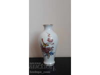 Small porcelain vase decorated with flowers and a bird, gilded