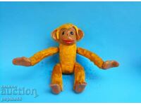 Plush monkey with wind-up mechanism