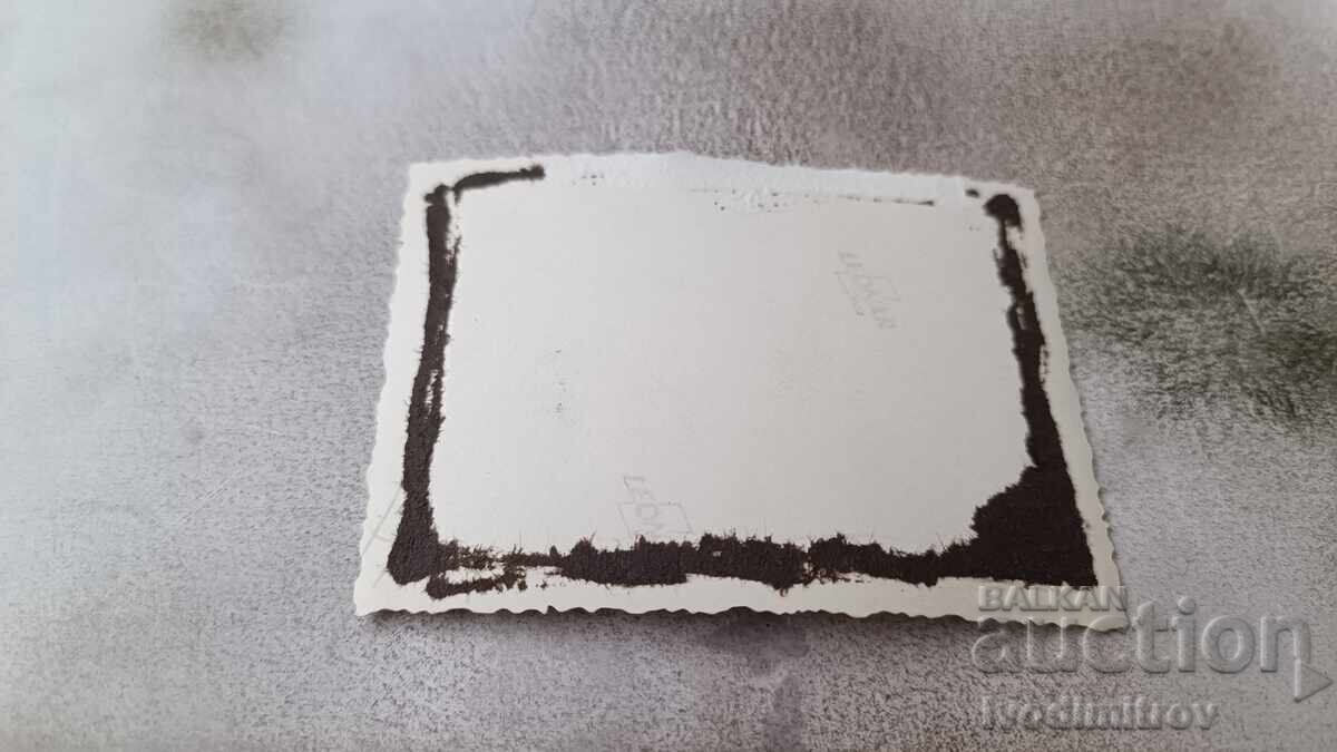 Photo of a young man and two young girls lying on the beach with price 1.85 BGN | € 0.95