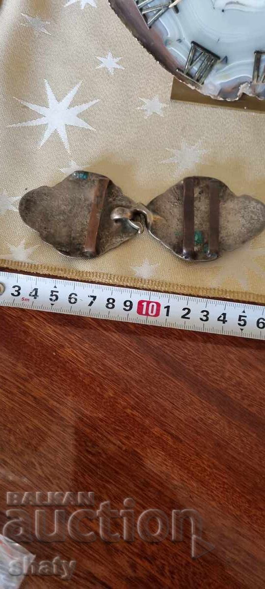 Delivery of Old silver buckles.