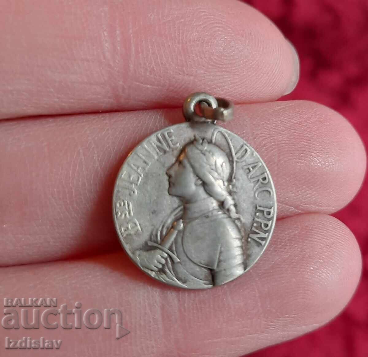 Old silver French medallion with Joan of Arc Old silver French medallion with Joan of Arc