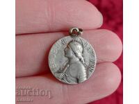 Old silver French medallion with Joan of Arc