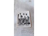 Photo Three young men on a tennis court 1952