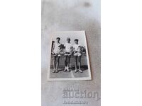 Photo Three young men on a tennis court 1952