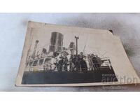 Photo Men and women aboard a steamer