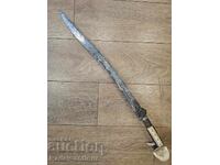 A great scimitar with silver inlays and walrus tusk hilts