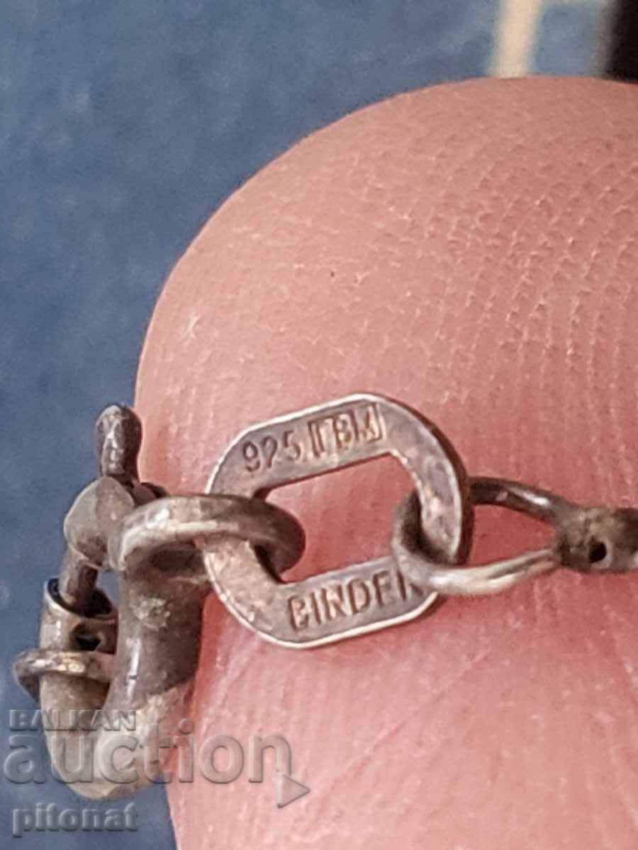 Auction Antique silver chain with a football player Auction Antique silver chain with a football player