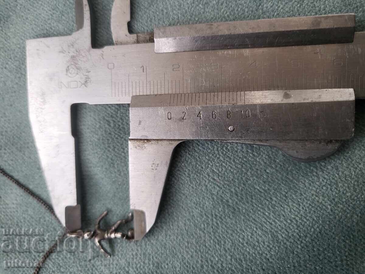 Delivery of Antique silver chain with a football player Delivery of Antique silver chain with a football player