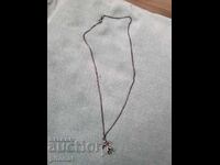 Antique silver chain with a football player