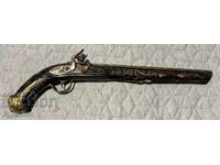 Flintlock pistol, richly decorated, mother of pearl, inlays.