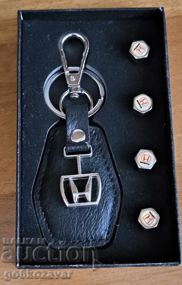key ring with the Honda emblem and 4 tire screws key ring with the Honda emblem and 4 tire screws