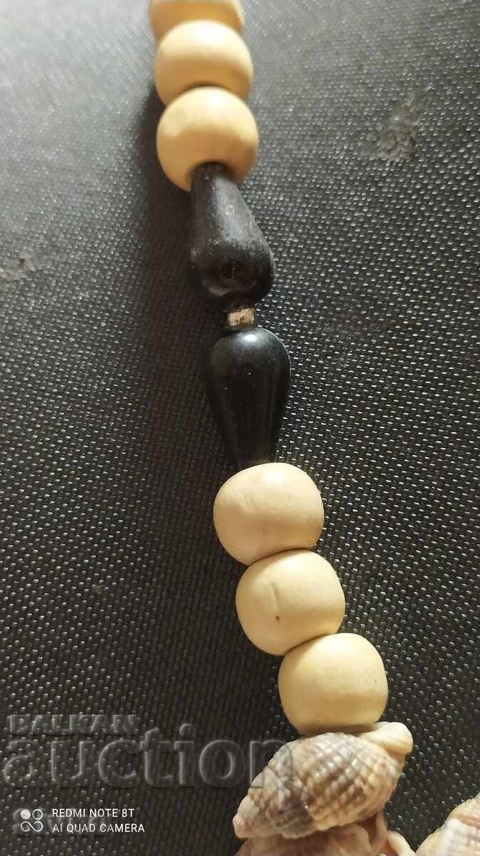 Auction Necklace of small shells and wood Auction Necklace of small shells and wood