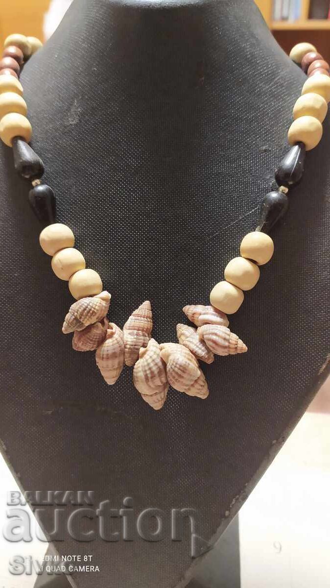 Necklace of small shells and wood Necklace of small shells and wood