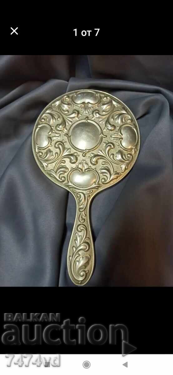 Old ladies' mirror, massive with ornaments Old ladies' mirror, massive with ornaments