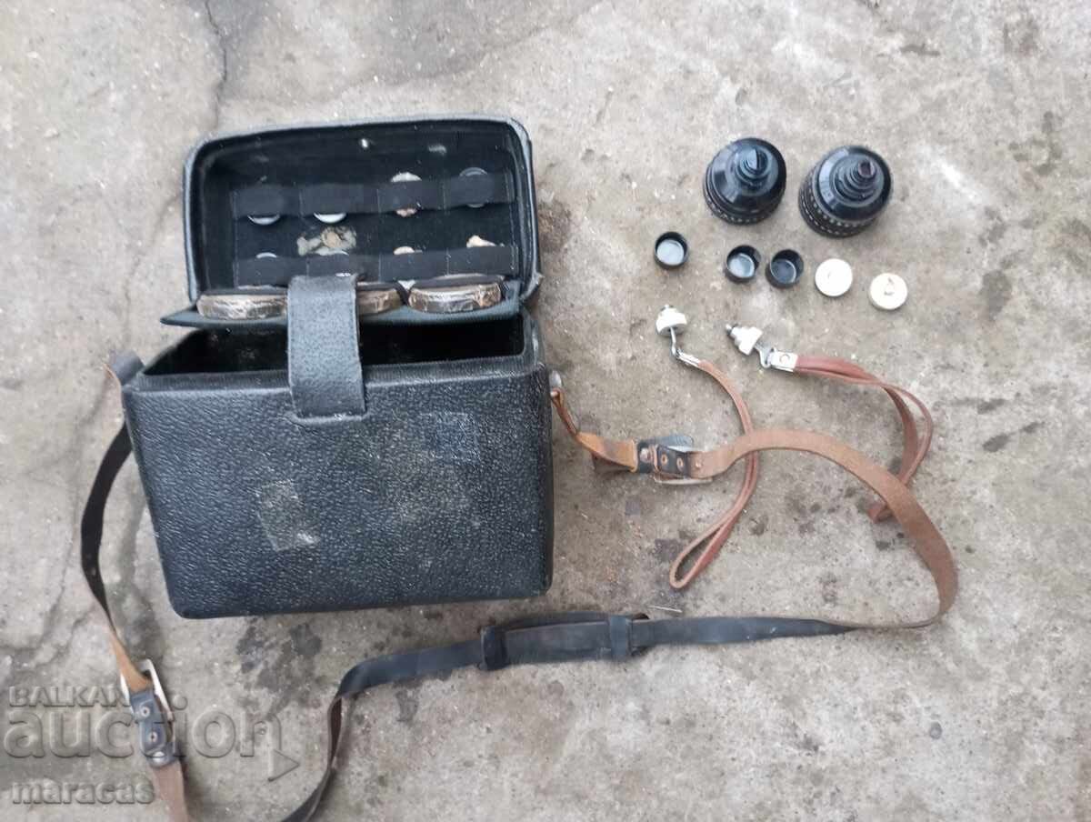 Old camera box with filters and lenses. Old camera box with filters and lenses.