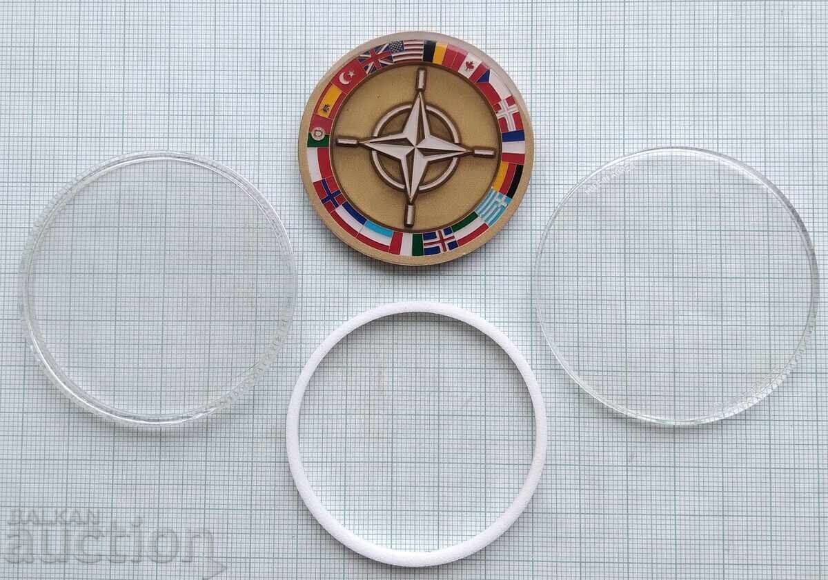 Delivery of 18372 NATO plaque in protective capsule Delivery of 18372 NATO plaque in protective capsule