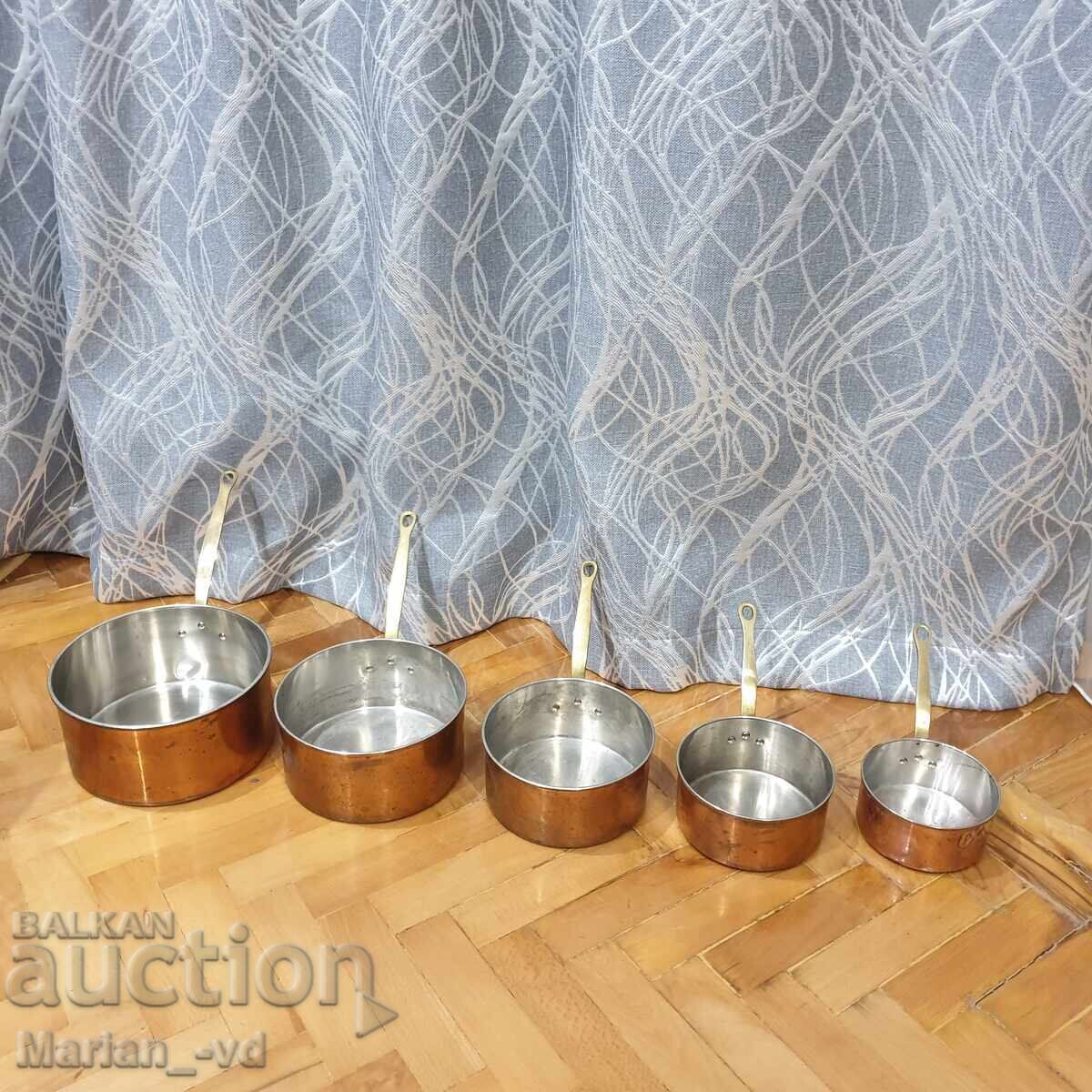 Set of copper pans with bronze handles Set of copper pans with bronze handles