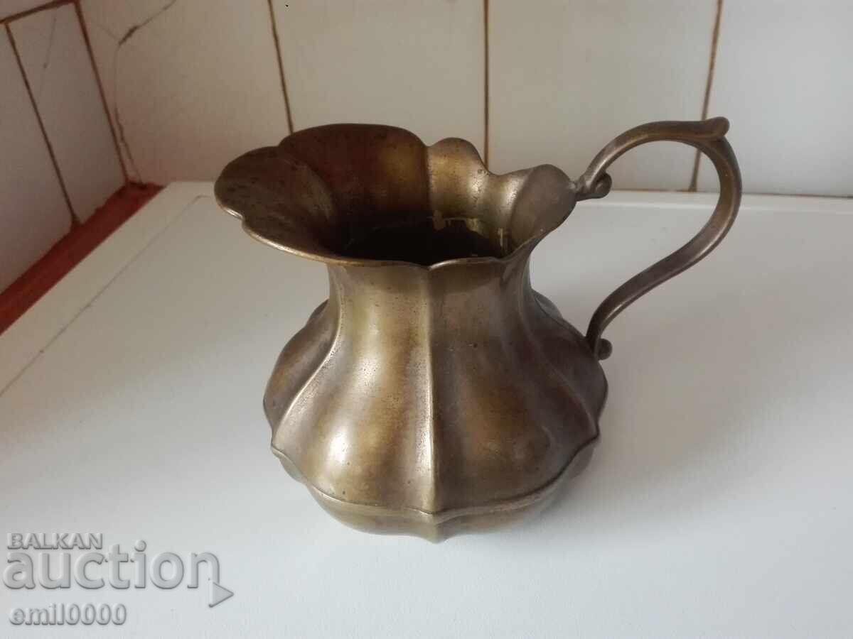 A beautiful bronze jug. A beautiful bronze jug.