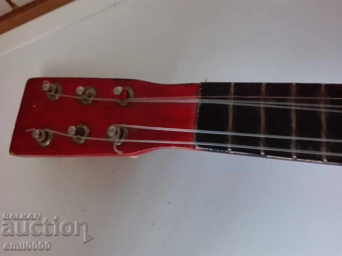 Auction  Children's guitar.