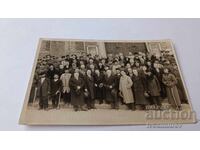 Sister Sofia Officers and men at an official celebration in front of a church