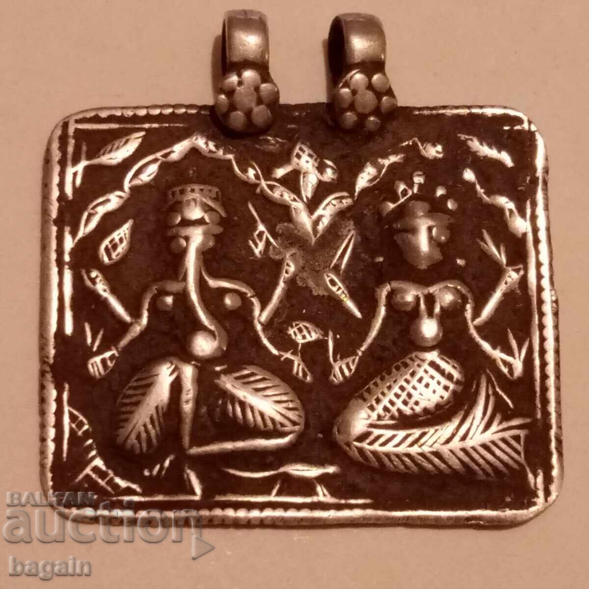 Silver talisman. Ganesha and Lakshmi.