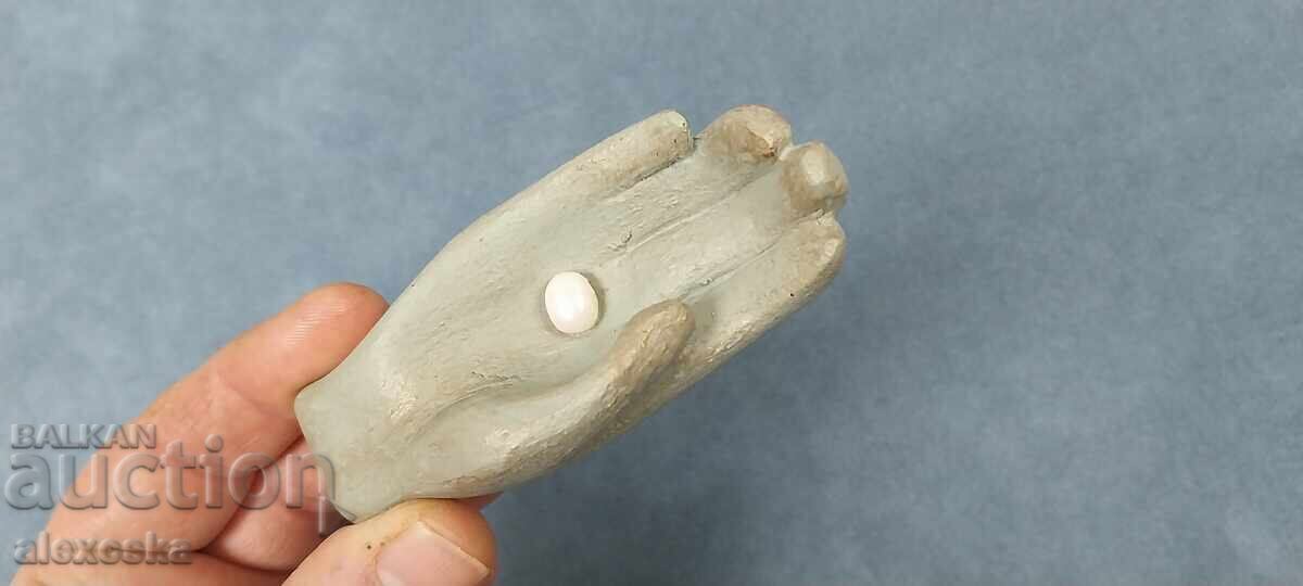 "Hand" with pearl