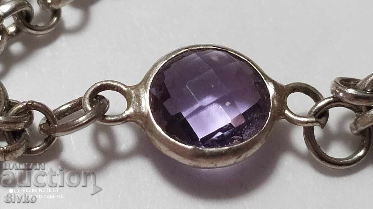 Delivery of Grivna with a natural stone resembling amethyst