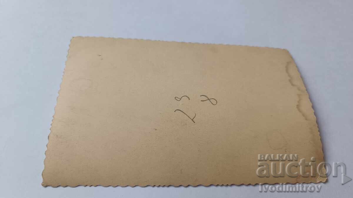 Photo of Two Young Women in Front of a Frozen Fountain in Winter with price 2.65 BGN | € 1.35