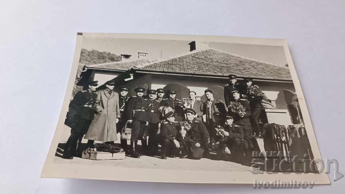 Photo of Officers and Men with Bouquets Photo of Officers and Men with Bouquets