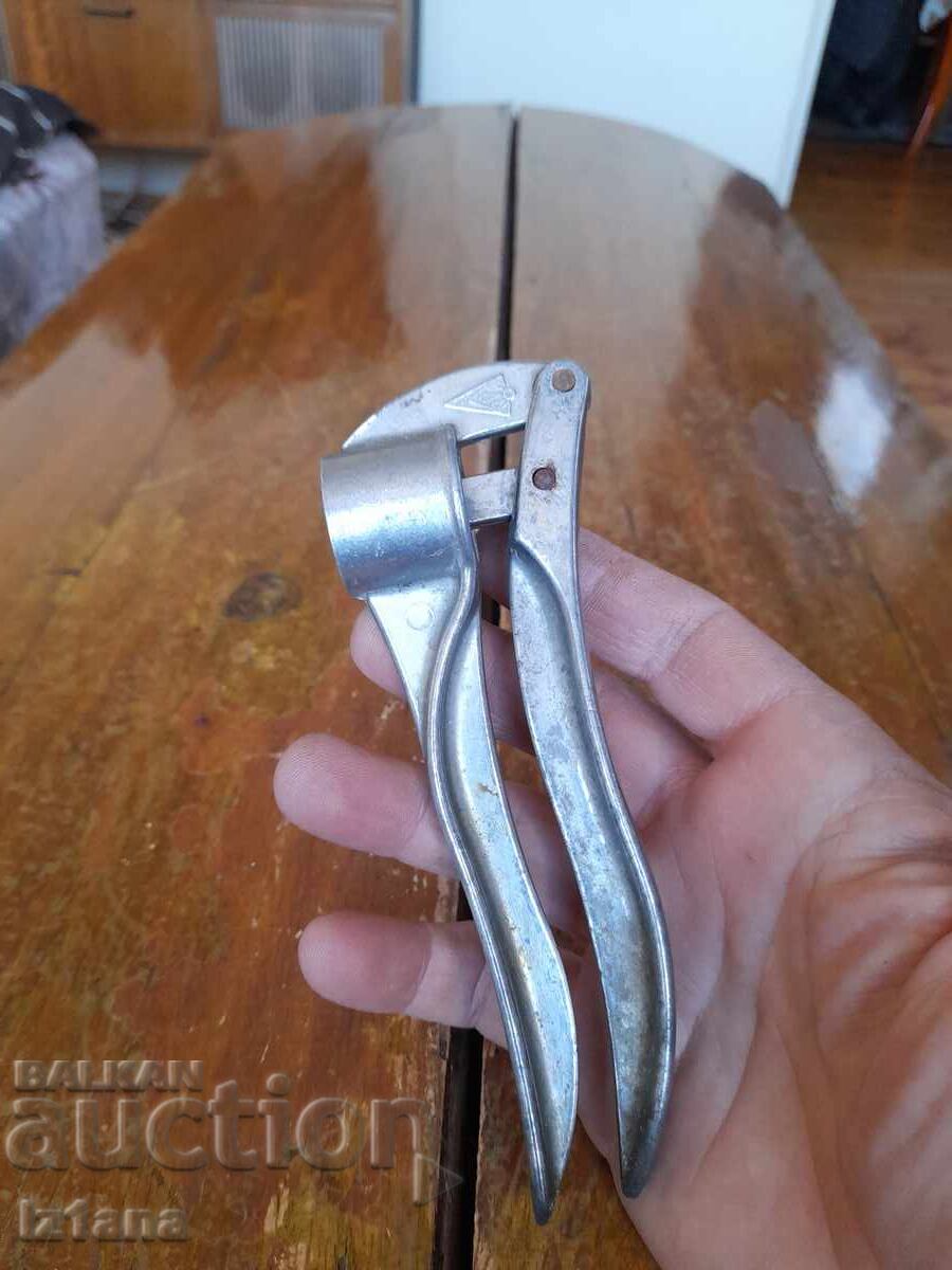 Old aluminum garlic press with price 22.00 BGN | € 11.25 Old aluminum garlic press with price 22.00 BGN | € 11.25