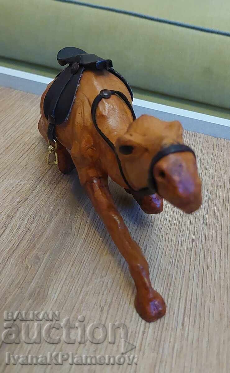 Auction  Leather-wrapped figurine for connoisseurs