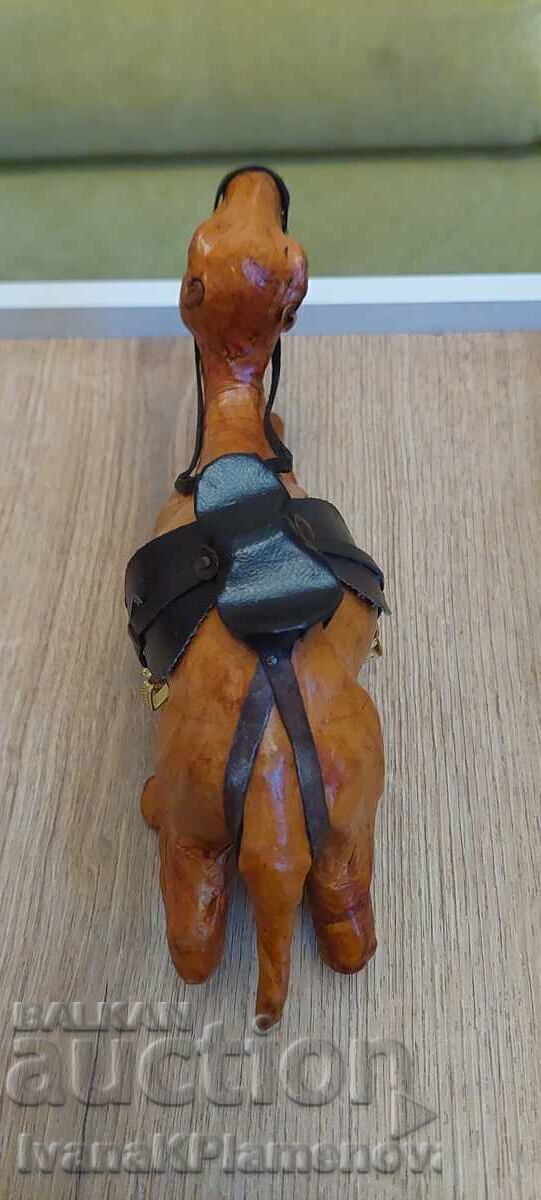 Delivery of Leather-wrapped figurine for connoisseurs