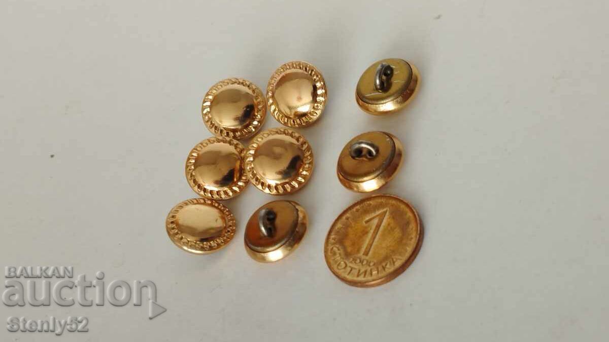 8 metal buttons with a golden shine