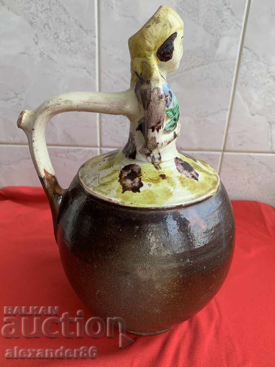 Delivery of Old wedding jug, girl with flower Delivery of Old wedding jug, girl with flower