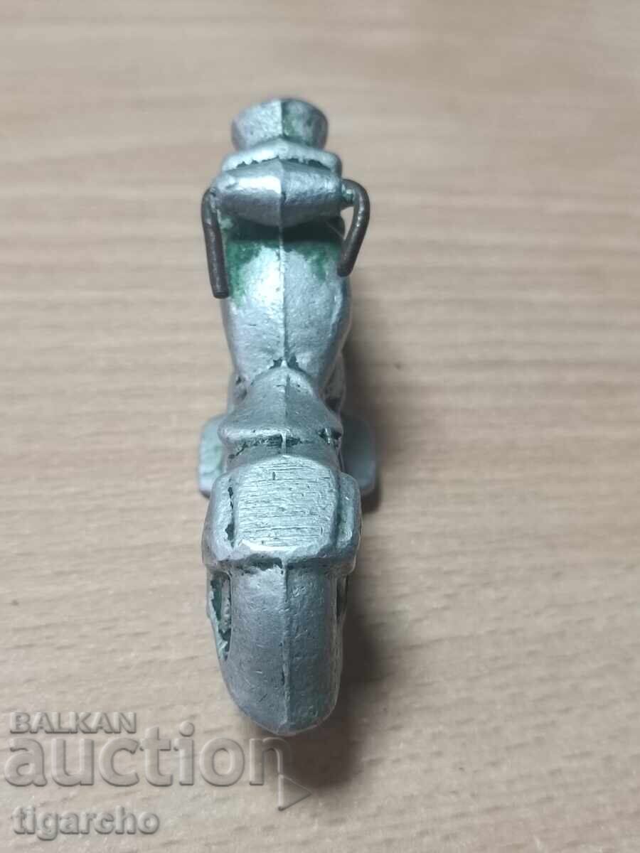 Delivery of Old metal toy motorcycle
