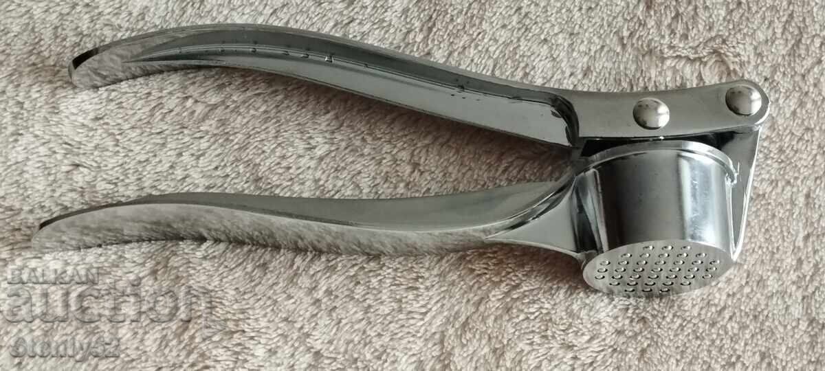 Auction Garlic press - new Auction Garlic press - new