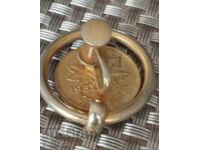 Cent canadian din 1952, insignă