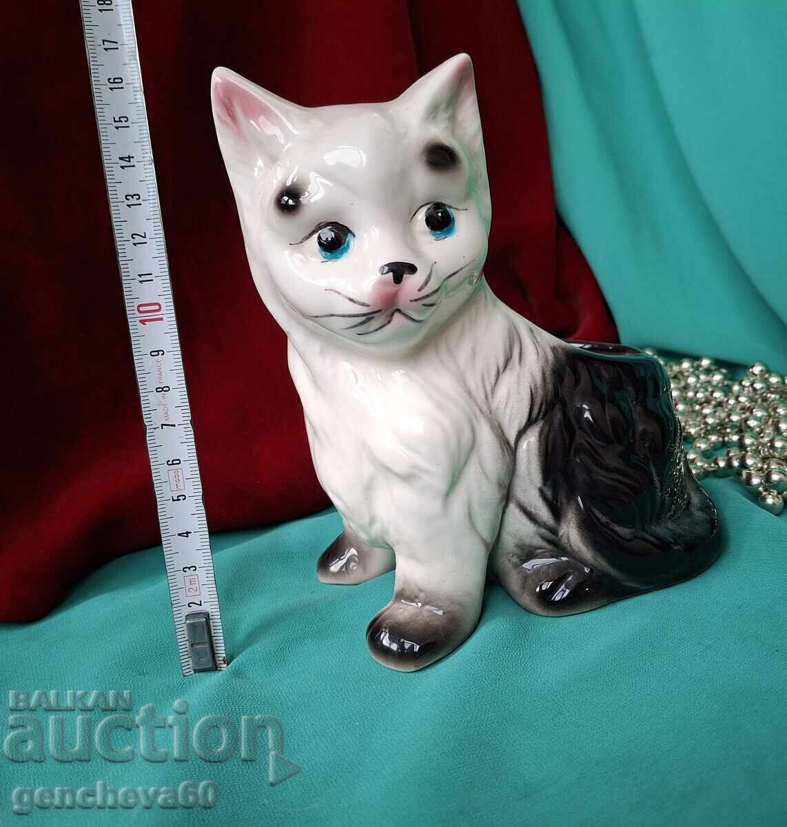 Delivery of Black and white porcelain cat with a bouquet/cachepot