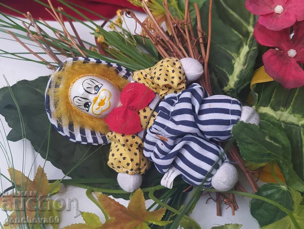 Interesting bouquet of artificial flowers with a clown with price 21.00 BGN | € 10.74 Interesting bouquet of artificial flowers with a clown with price 21.00 BGN | € 10.74